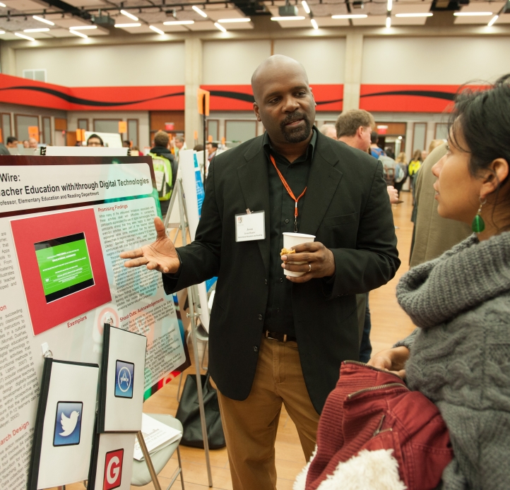 Professor sharing research poster